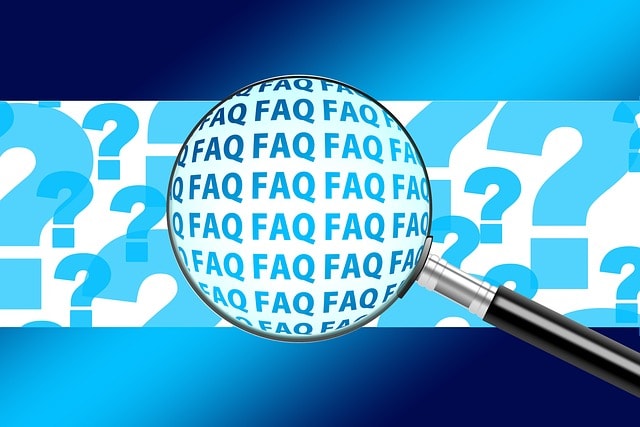 A magnifying glass above the word FAQ.