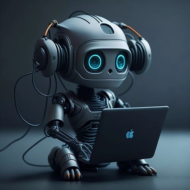 A grey robot with headphones working on an Apple laptop.