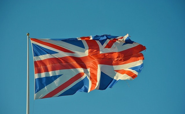 A british flag on a mast.