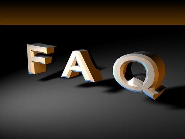 The word "FAQ" written with 3D letters on top of a black surface