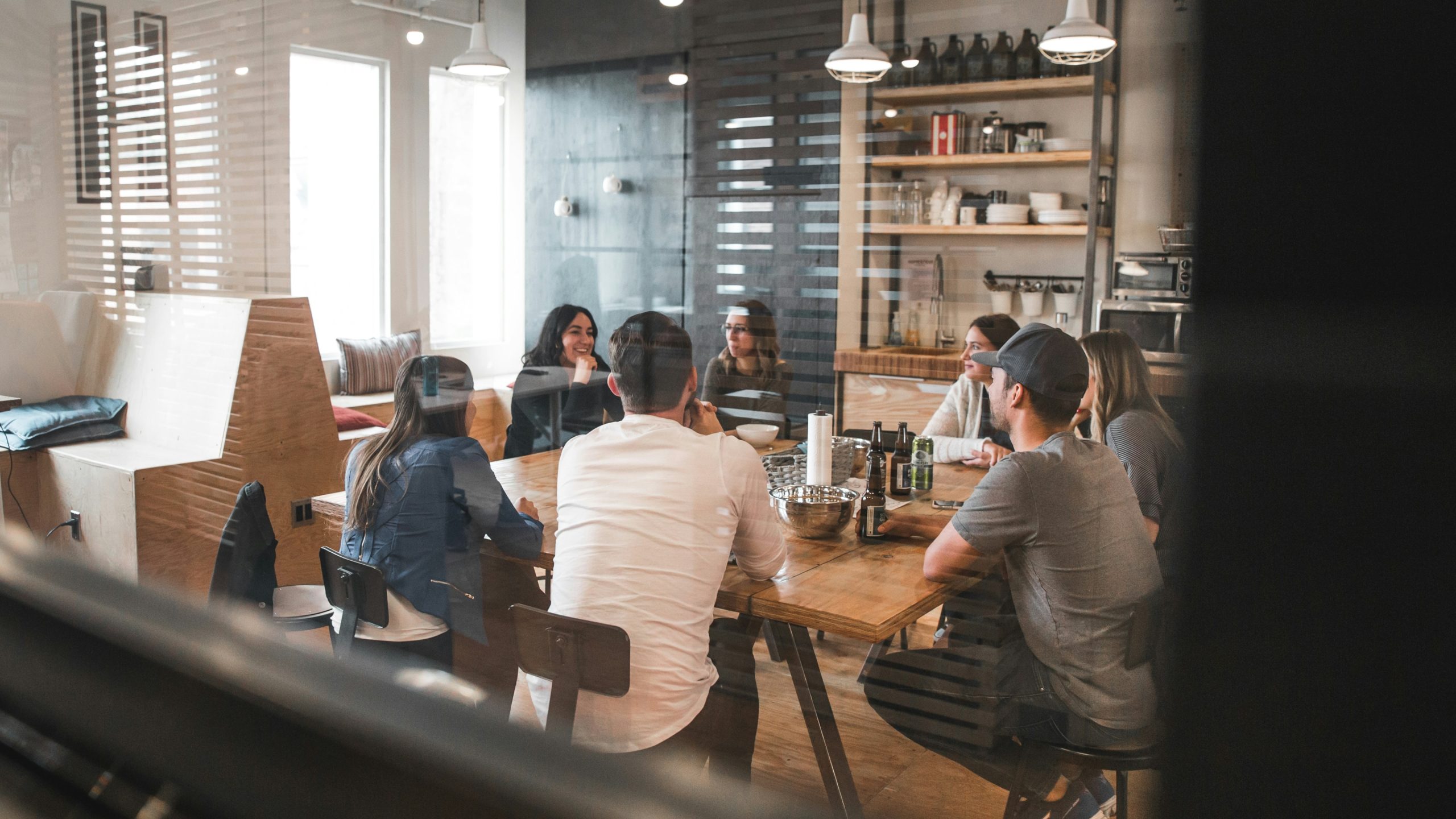 A group of people sitting in a modern meeting room. 