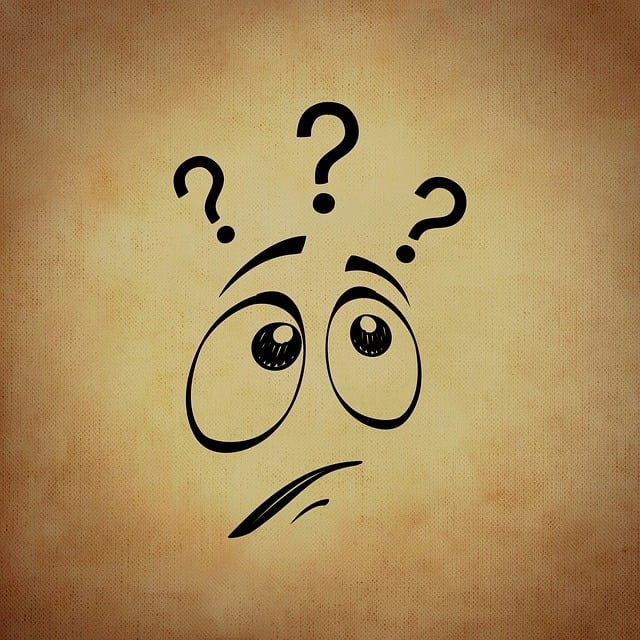 A face emoticon with three question marks above it.