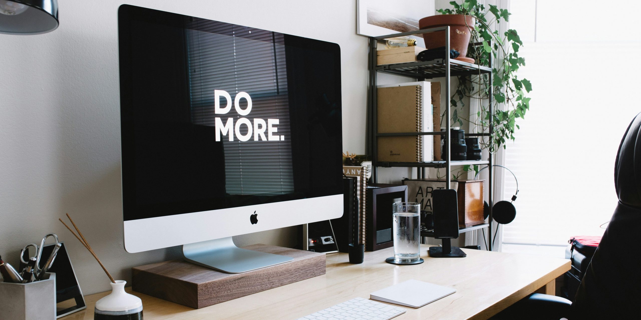 A Mac computer with the words "Do More" on its screen.