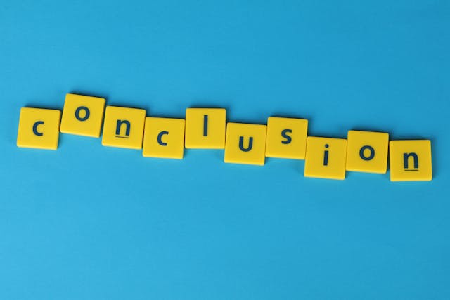 The word conclusion in blue font on yellow tiles against a light blue background.