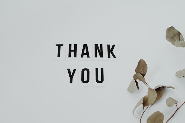 Black letters that spell “Thank You” on a white background.