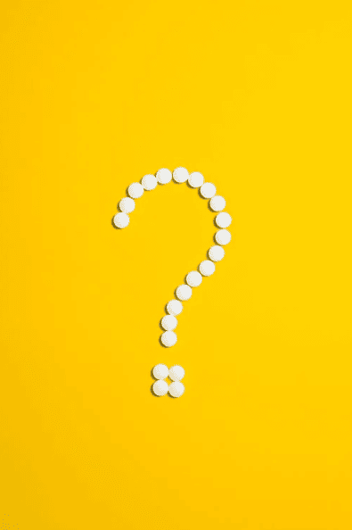 A white question mark on a yellow background. 