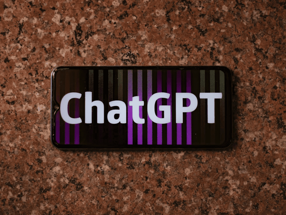 The word "ChatGPT" on a mobile devcie screen. 