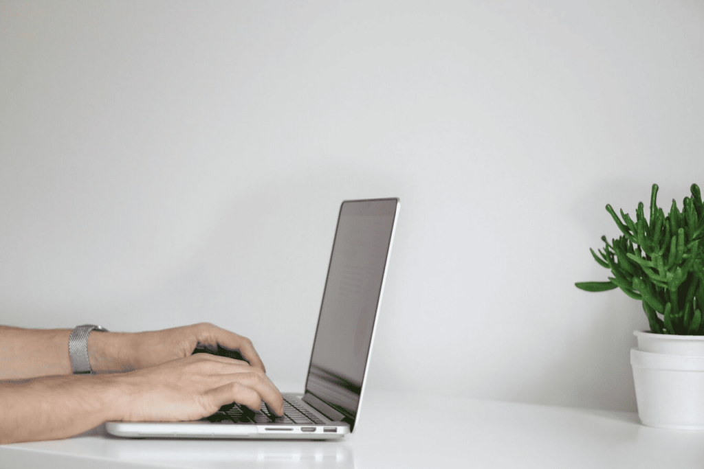 A person typing on a laptop.