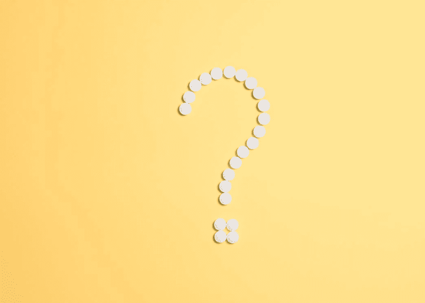 A white questions mark on a yellow background. 