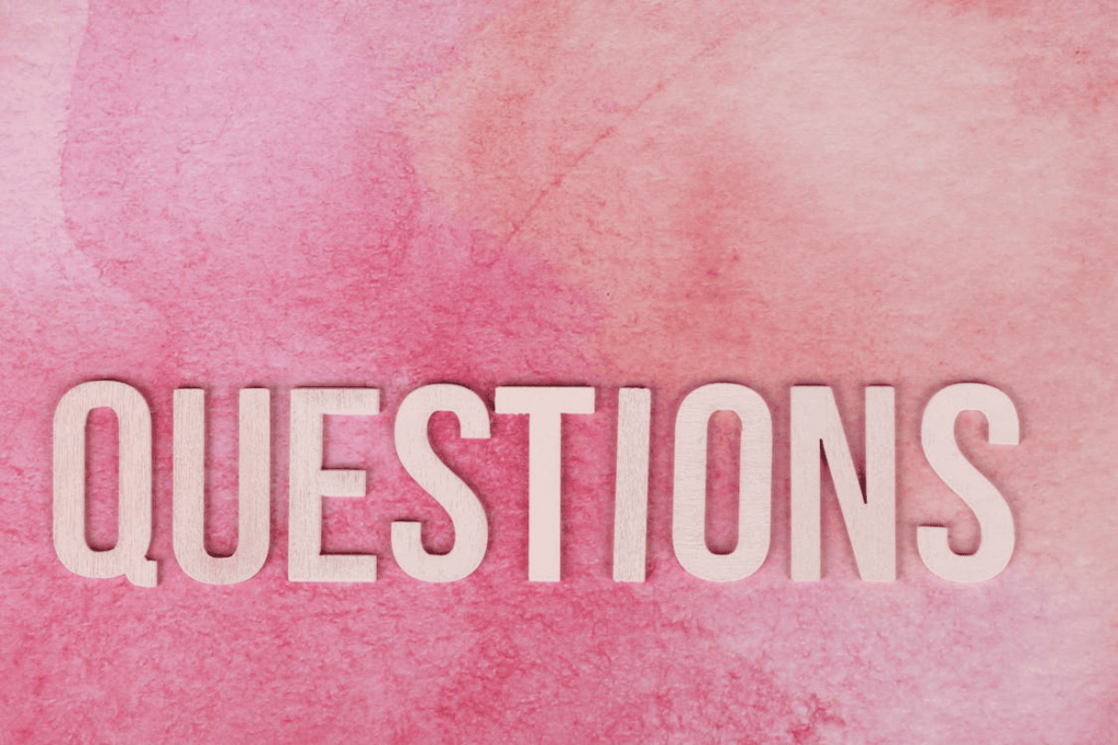 The word "questions" with a pink background.