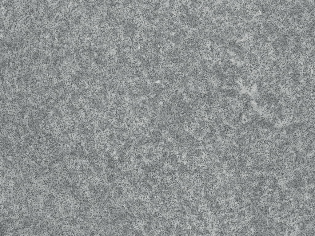 A close up of a gray granite surface.