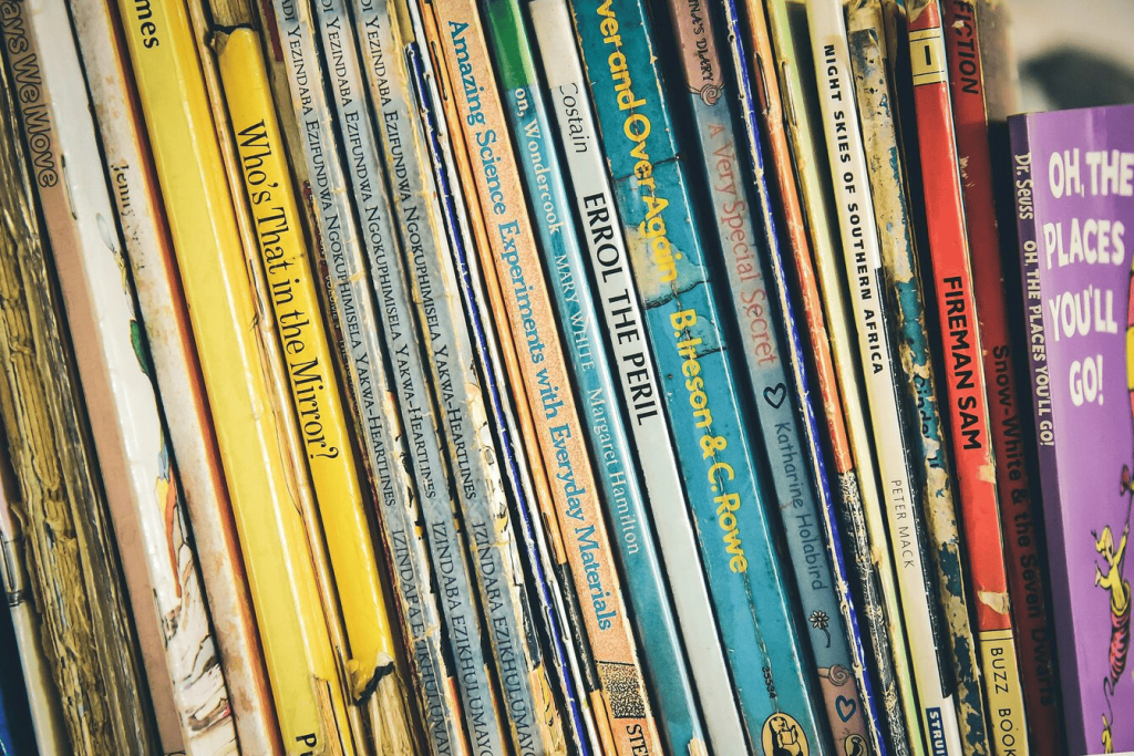 A pile of books leaning on each other.