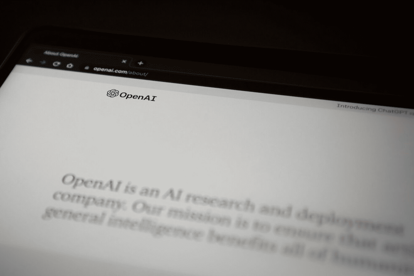 A close up of a computer screen with a message about OpenAI.