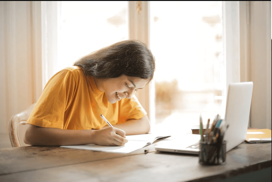 A girl doing her homework. 