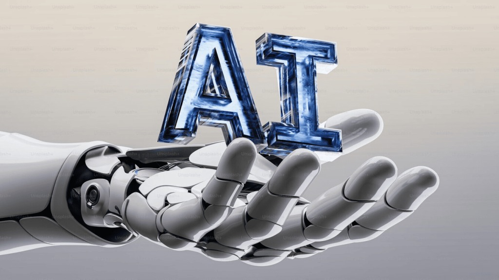 A robot hand holding a word that says "AI."