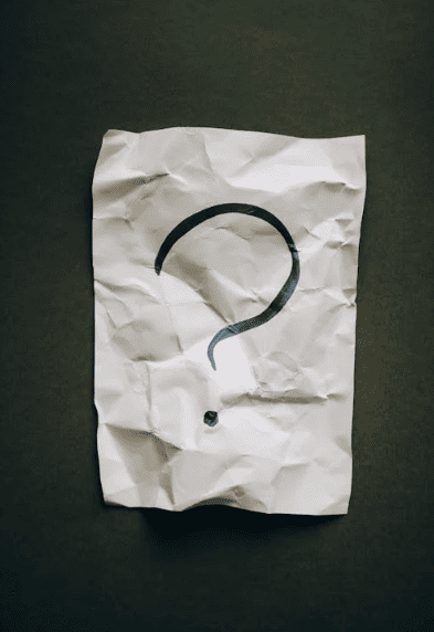 A question mark on a crumpled up piece of paper. 