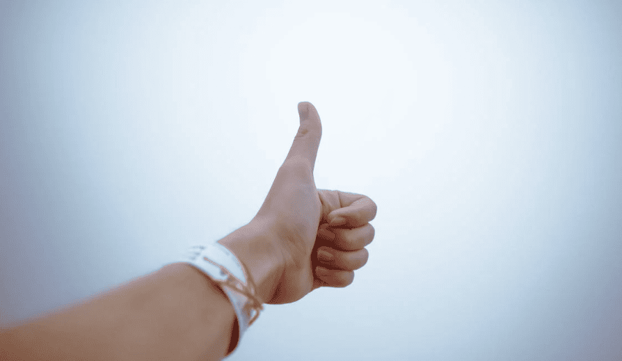 A person doing a thumbs up. 