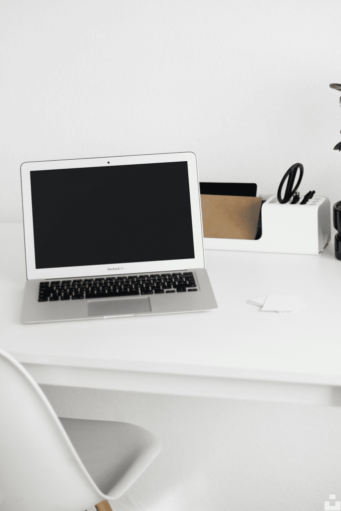 A laptop on a white surface.