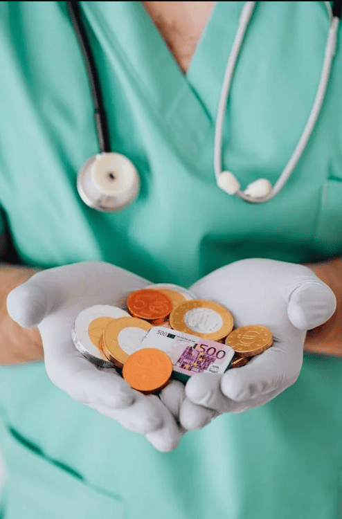 A doctor holding money. 