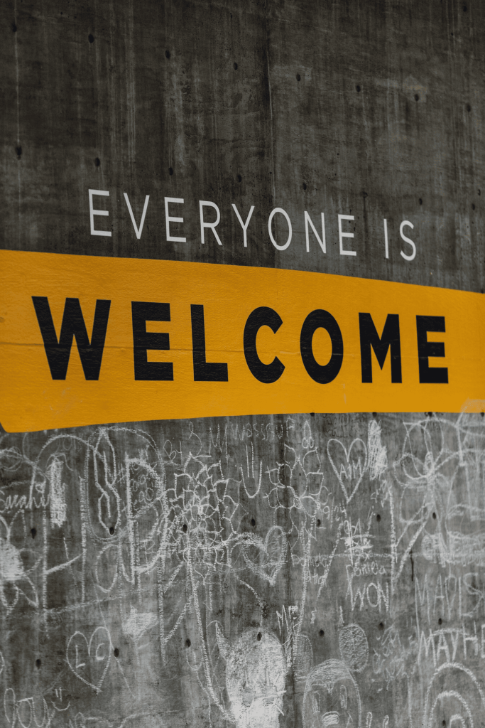 A message on a wall that states "Everyone is welcome."