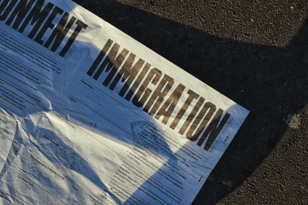 The word "immigration" on a newspaper. 