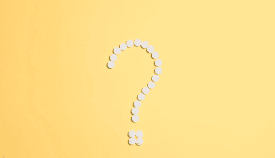 A white question mark on a yellow background. 