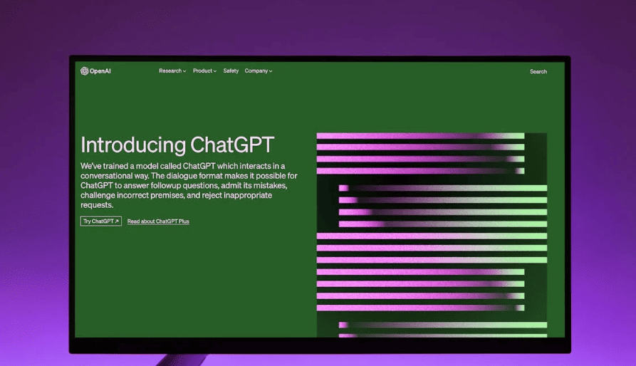 The OpenAI Website with an introduction to ChatGPT on a computer monitor.