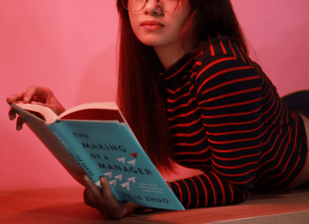 A woman reading a book. 